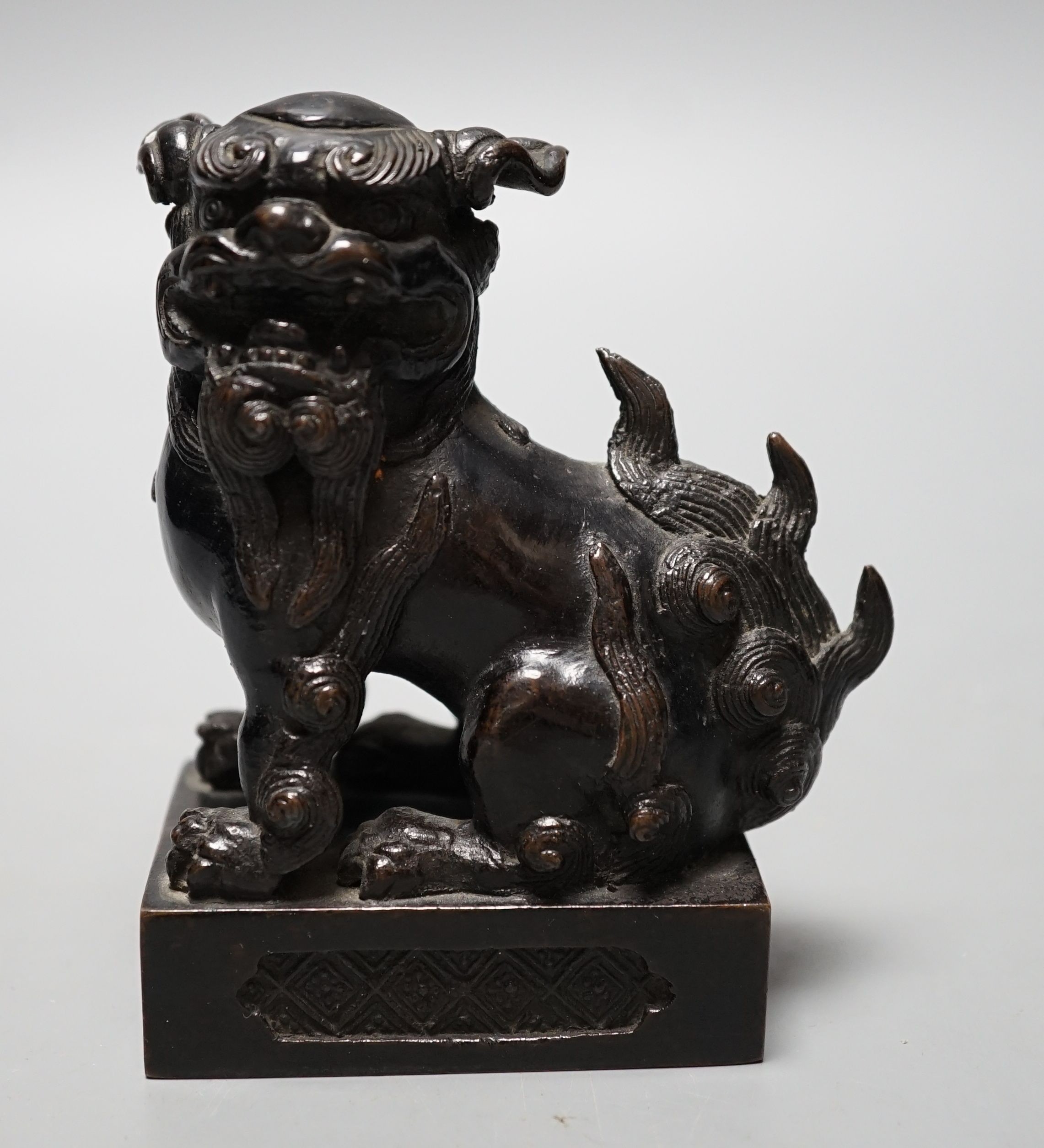 A Japanese bronze Buddhistic lion, Nogara, Noburu mark to base, 11cm